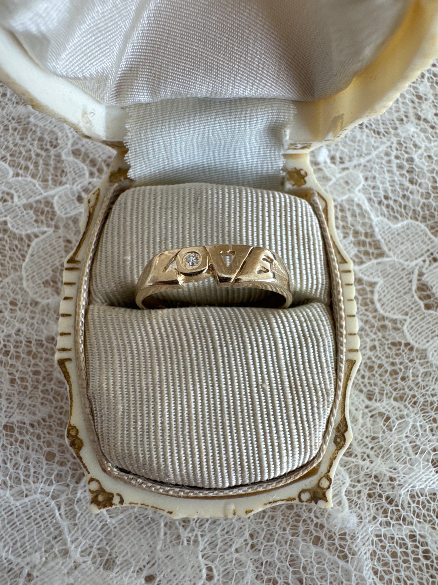 vintage 14k yellow gold "love" ring with diamond accent
